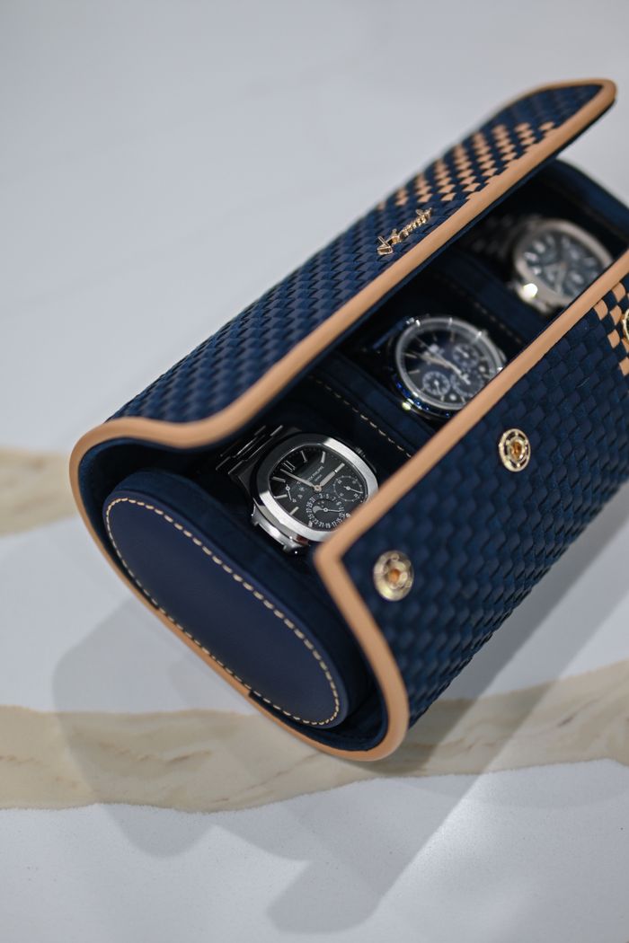 Luxurious watches in an elegant blue and gold case, showcasing style and wealth.